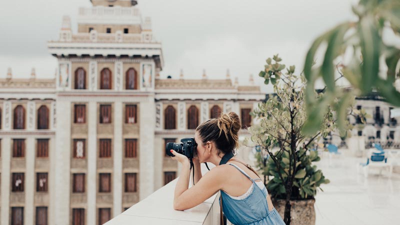 photographer-taking-photo-of-a-building